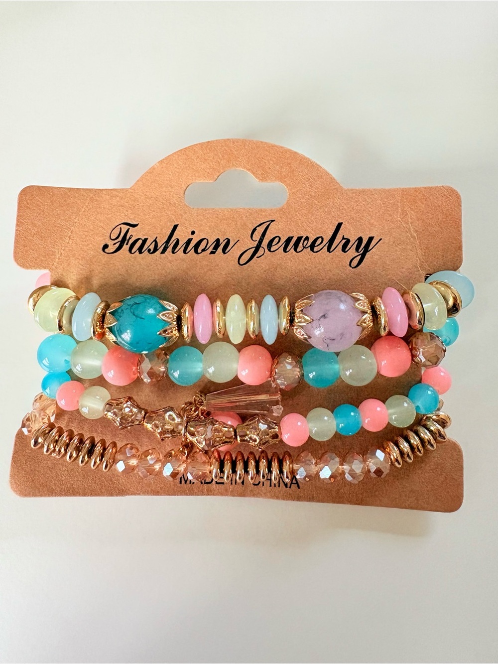 Multi-colored beaded bracelets with pink, blue, and white beads #beaded #bracele